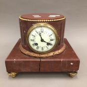 A marble pedestal clock