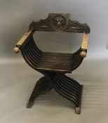 A 19th century folding X-frame open armchair,