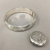 A vintage hallmarked silver bangle and a round silver stud