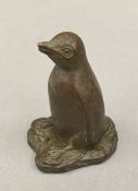 A small Japanese bronze model of a penguin