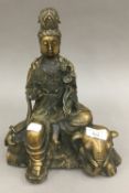 A brass model of Guanyin seating on an elephant