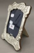 A silver Art Nouveau style frame