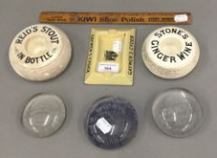 A collection of advertising match holders and paperweights, etc.