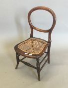 A Victorian child's balloon back chair
