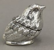 A silver vesta formed as a bird