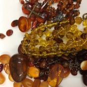 A quantity of loose amber and other stones,