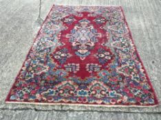 A Persian style wool rug