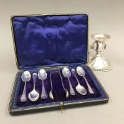 A cased set of silver teaspoons and tongs,