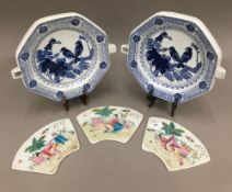 Two Chinese plate warmers and three erotic panels