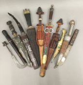 A collection of African and Middle Eastern daggers,