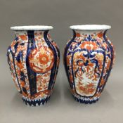 A pair of Imari vases and an Imari jardiniere