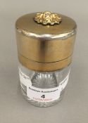 An unusual silver gilt and glass jar, the hinged lid with applied lions head,
