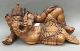 A carved wooden model of Ganesh