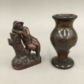 A small 19th century semi erotic hardwood carving on an unclad figure asleep against a tree trunk