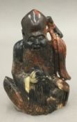 A late 19th century Chinese carved soapstone model of Buddha