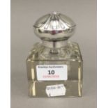 An 800 silver topped inkwell with a square cut crystal base