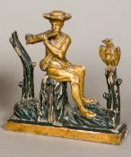 An 18th/19th century Continental carved giltwood and ebonised figure of a gentleman playing the