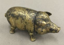 A brass vesta in the form of a pig