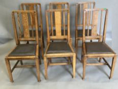 A set of six early 20th century oak dining chairs