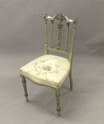 A 19th century French green painted boudoir chair