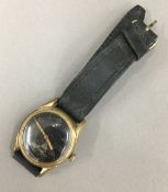 A black faced German wristwatch
