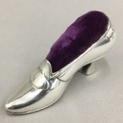 A Gorham and Co sterling silver pin cushion in the form of a lady's shoe