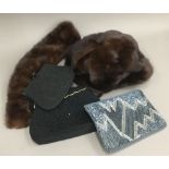 Three evening clutch bags belonging to Daphne du Maurier, one black beaded bag with flower detail,