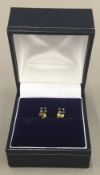 A pair of 9 ct gold sapphire earrings