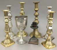 A quantity of brass and plated candlesticks,