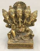 An Eastern bronze model of a multi-headed deity