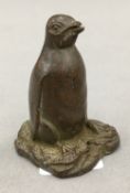 A bronze model of a penguin