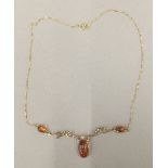 A 9 ct gold and amber necklace (5.