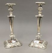 A pair of silver plated candlesticks