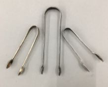 Three pairs of silver tongs