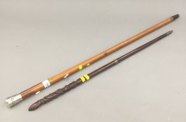 A Victorian malacca cane with Chinese silver top and an unusual carved swagger stick with figural