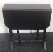 A Victorian ebonised Sutherland table and an early 20th century oak child's chair