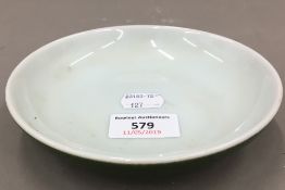 A small Chinese green glazed dish