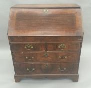 An 18th century walnut bureau with fitter interior and a well