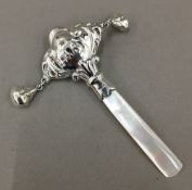 A silver baby rattle