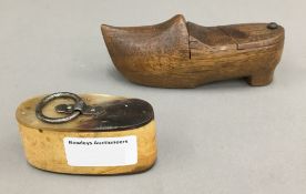 A 19th century horn snuff box and a treen snuff box formed as a clog