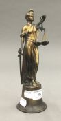 A gilt figure of justice