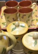 A quantity of decorative ceramic kitchen ware