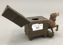 A bronze dog in kennel form inkwell