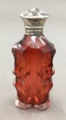 A cranberry glass scent bottle