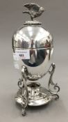 A silver plated egg coddler and cover,