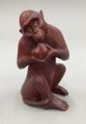 A Japanese carved wooden monkey