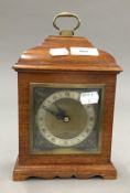 An Elliott walnut cased mantle clock