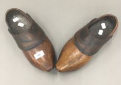 A pair of 19th century leather clad clogs