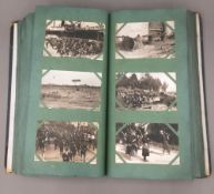 A postcard album containing various topographical and WWI military subjects