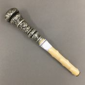 A Victorian silver mounted ivory parasol handle